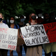 Workers at a Seattle Whole Foods protest against store management not allowing workers to wear Black Lives Matter apparel in June, 2020.